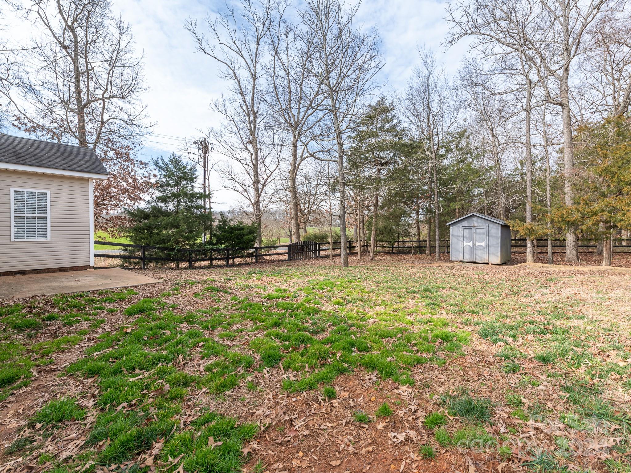 401 Funderburk Road Wingate, NC 28174 - Photo 35 of 36 a front view of a house with a yard and trees