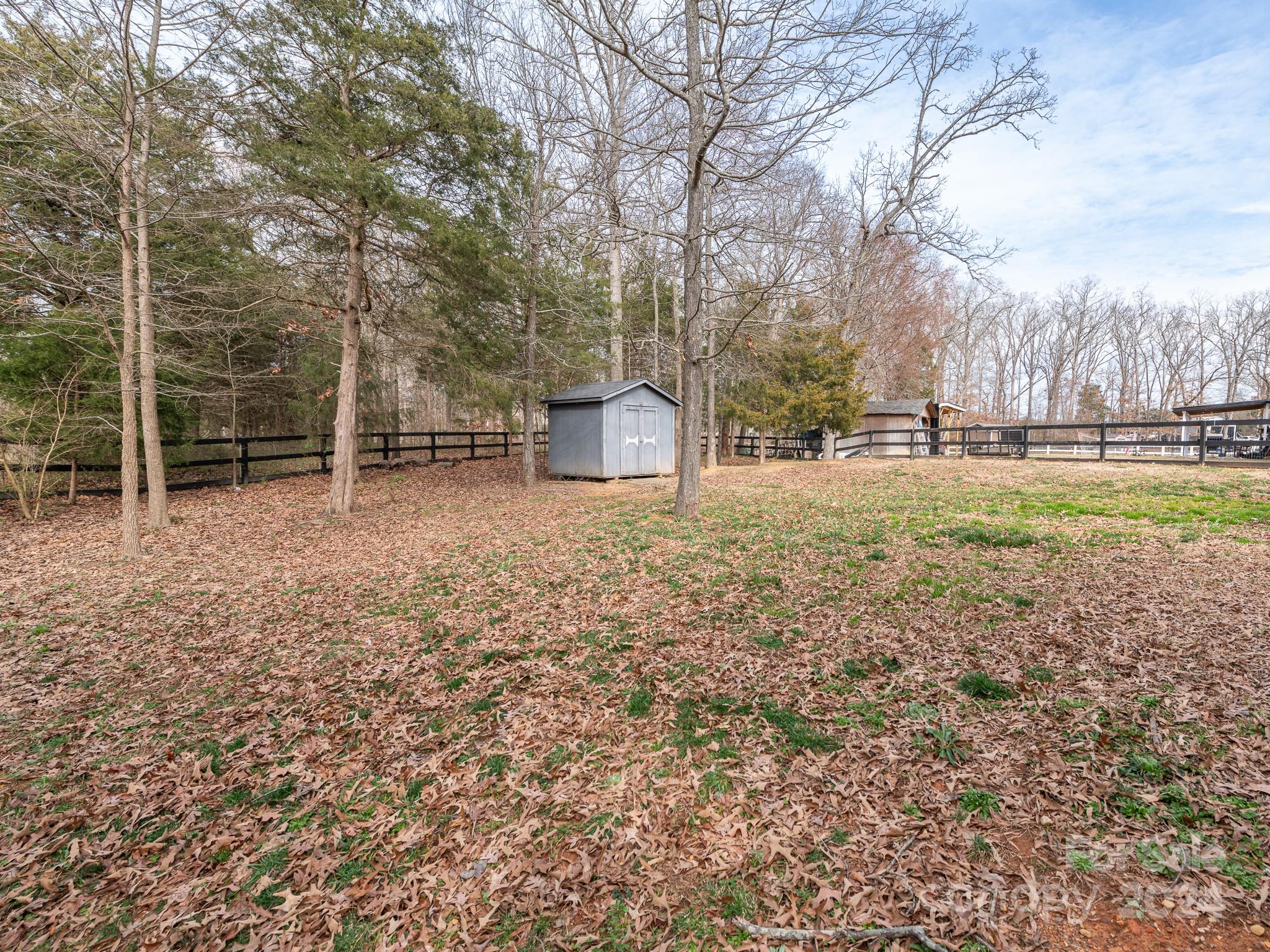 401 Funderburk Road Wingate, NC 28174 - Photo 36 of 36 a backyard of a house with lots of green space