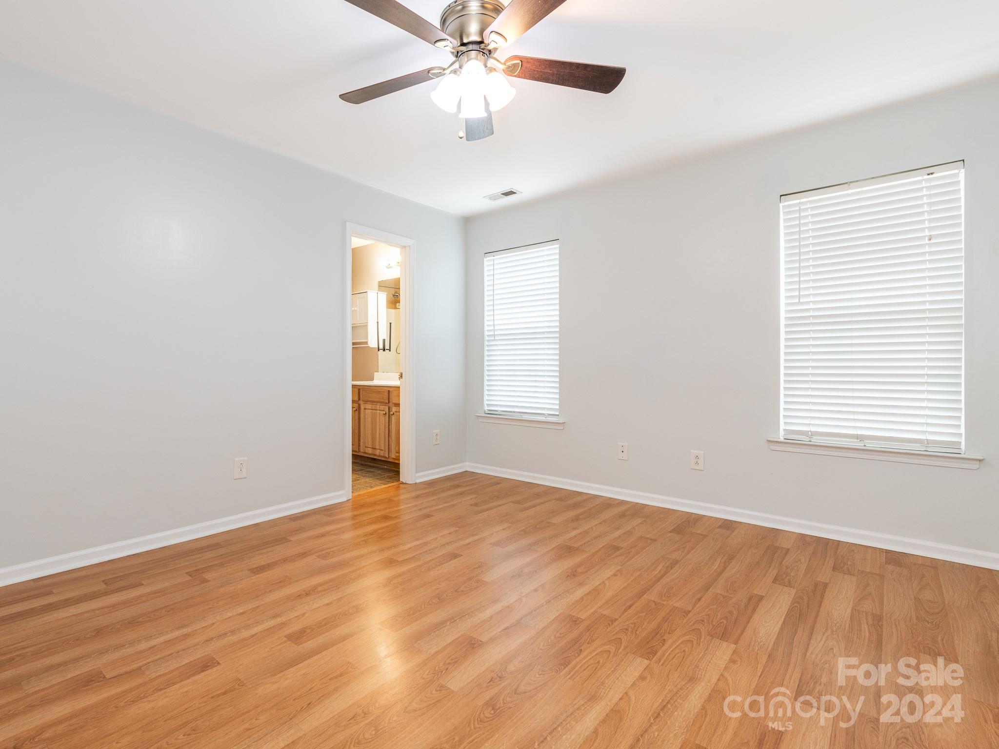 401 Funderburk Road Wingate, NC 28174 - Photo 5 of 36 wooden floor in an empty room with a window
