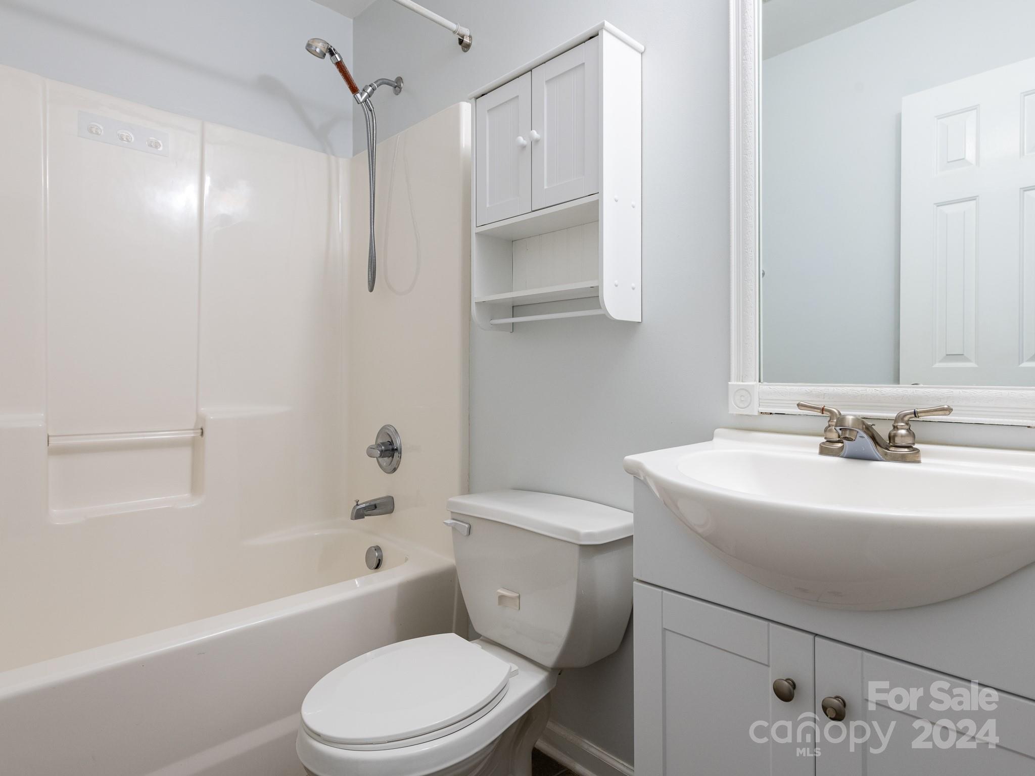 401 Funderburk Road Wingate, NC 28174 - Photo 8 of 36 a bathroom with a sink toilet tub and shower