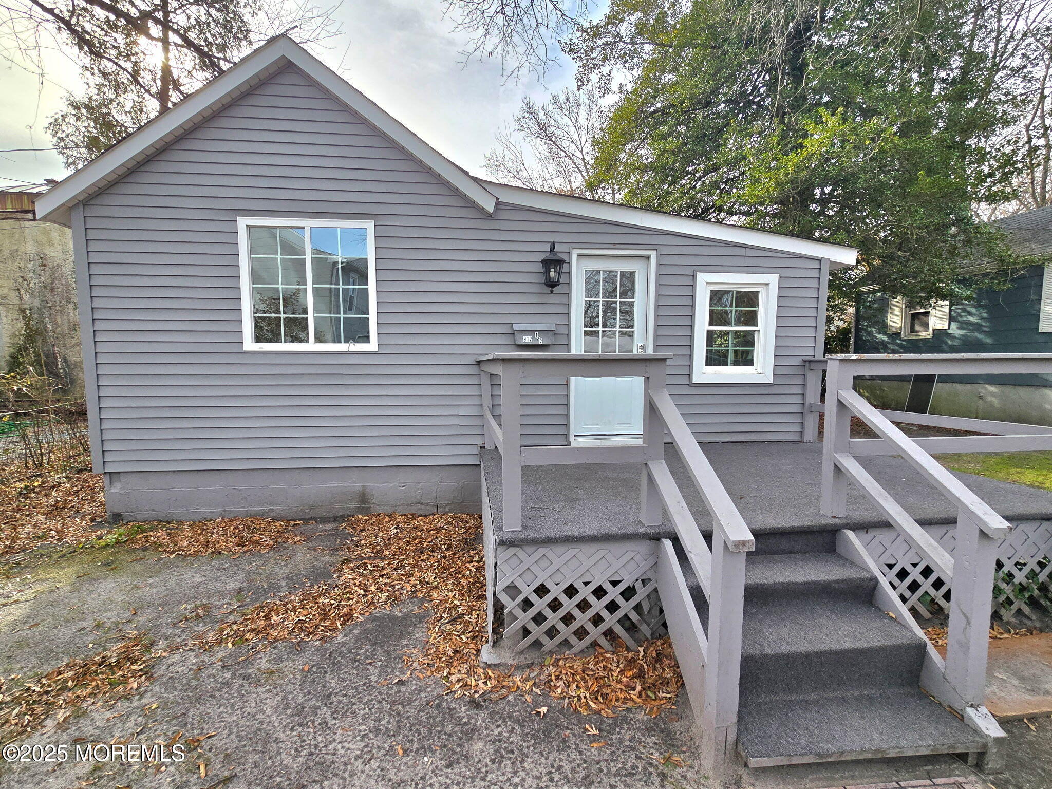 a house view with a backyard space