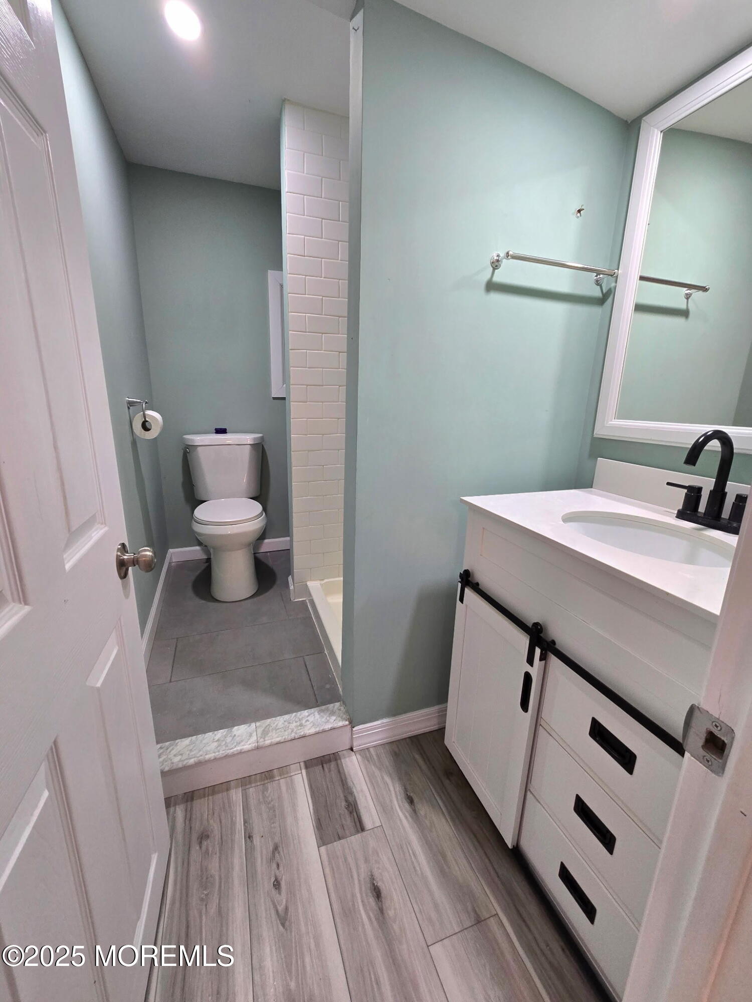 912 Sunset Avenue, Unit REAR Asbury Park, NJ 07712 - Photo 6 of 8 a bathroom with a sink and a toilet