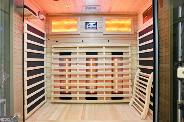 a view of a balcony with a door and wooden floor