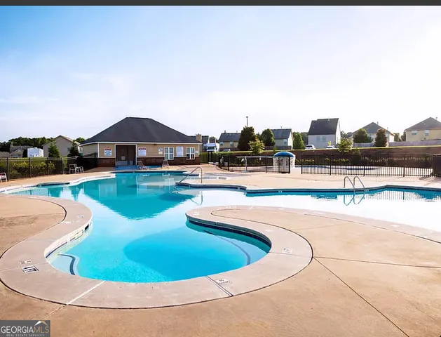 a view of a swimming pool with a terrace