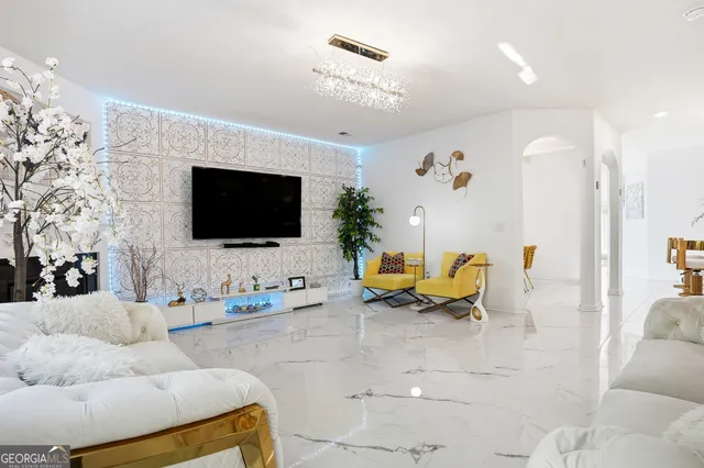 a living room with furniture and a flat screen tv