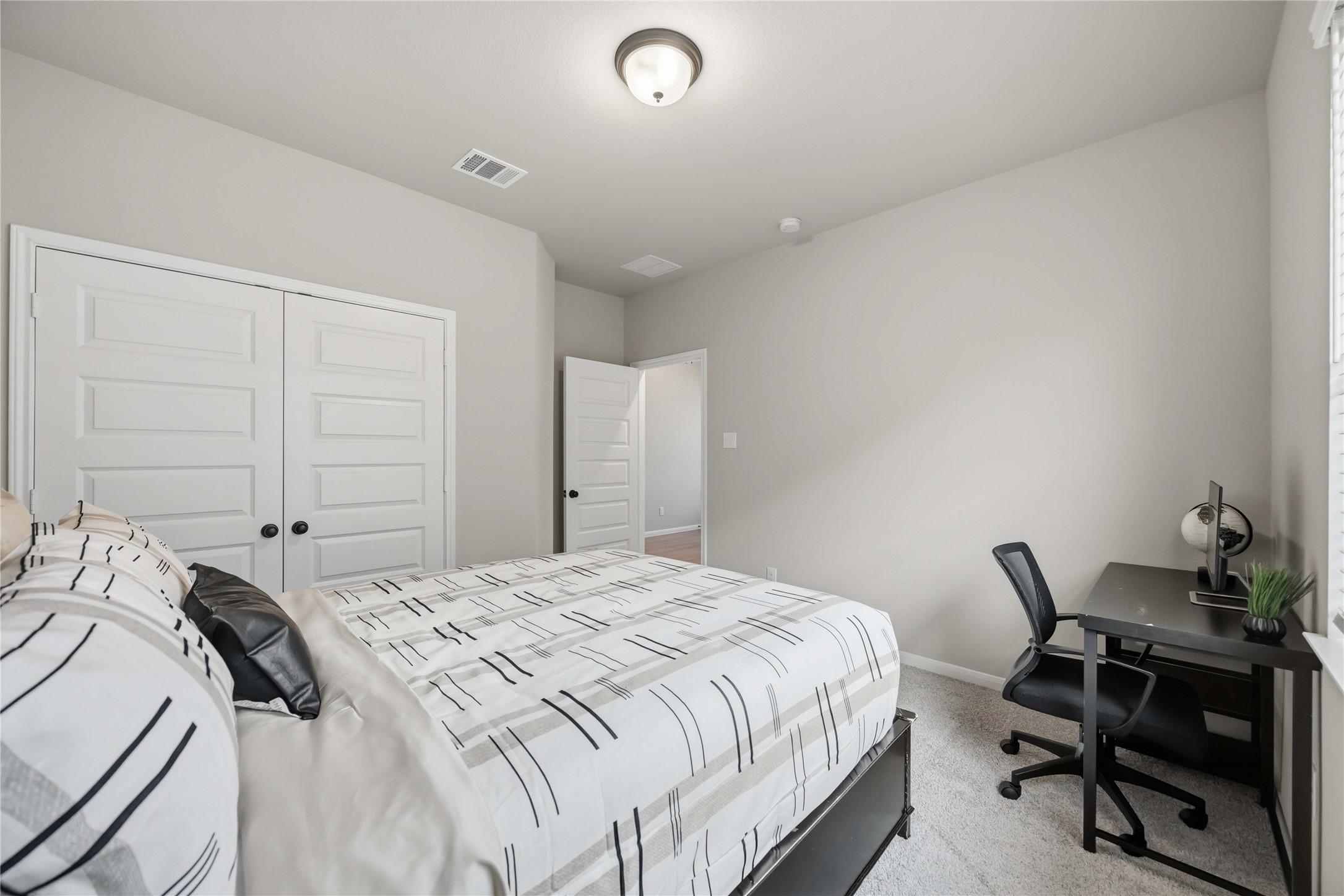 2808 Bisbee Road League City, TX 77573 - Photo 8 of 42 Bedroom 3- Grey Carpet & Black Finishes