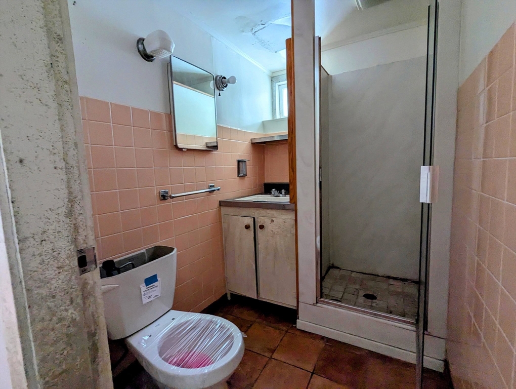 49 Enfield Road Pelham, MA 01002 - Photo 16 of 34 a bathroom with a sink a toilet and shower