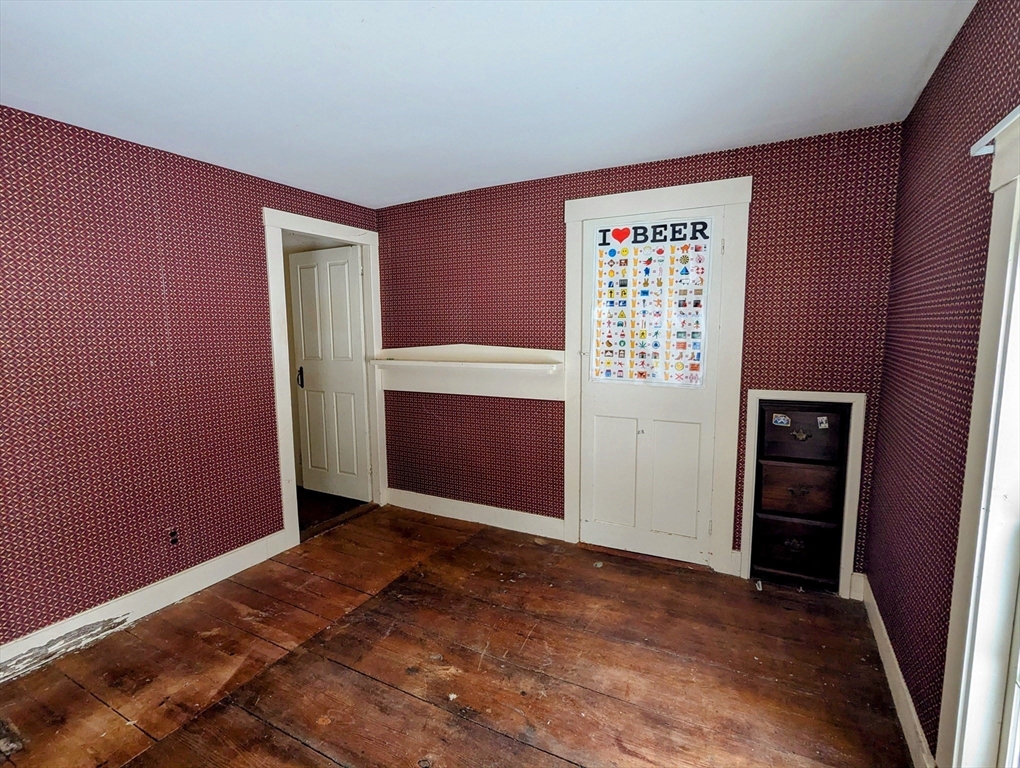 49 Enfield Road Pelham, MA 01002 - Photo 21 of 34 an empty room with closet and windows