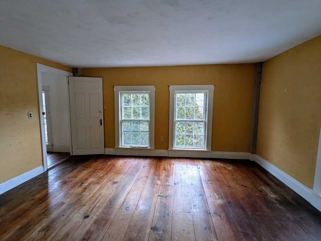 49 Enfield Road Pelham, MA 01002 - Photo 24 of 34 a view of room with window and wooden floor