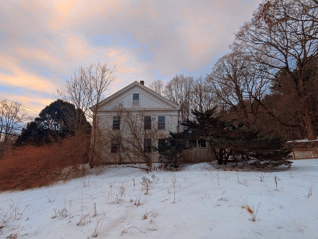 49 Enfield Road Pelham, MA 01002 - Photo 3 of 34 a front view of a house with a yard