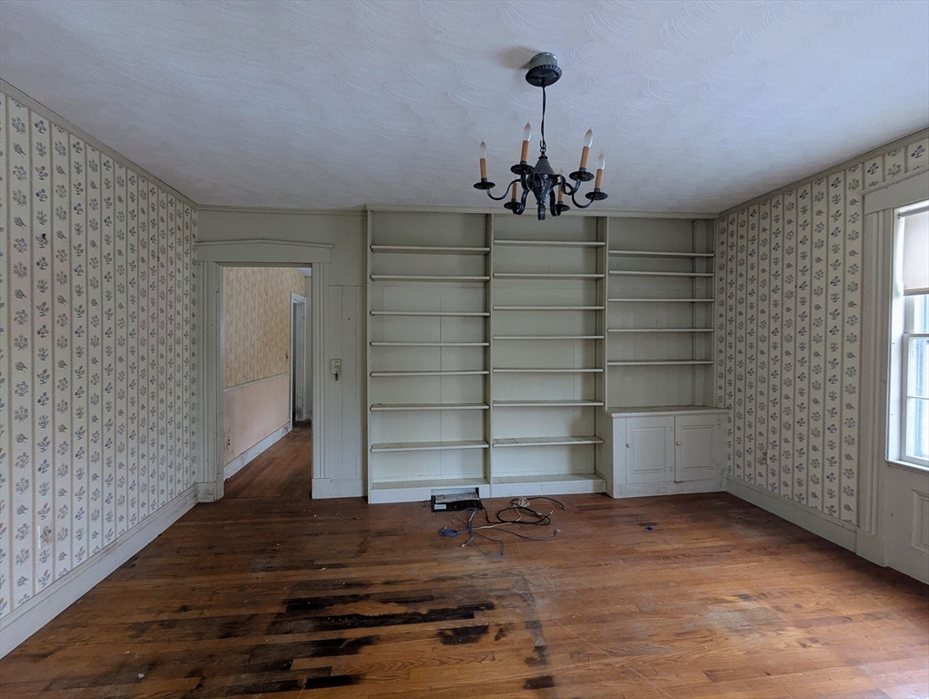 49 Enfield Road Pelham, MA 01002 - Photo 10 of 34 a view of a room with wooden floor and windows