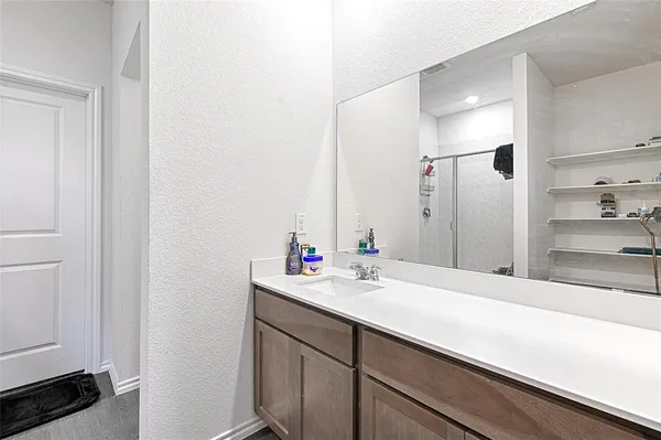 a bathroom with a sink and a mirror