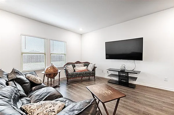 a kitchen with sink refrigerator and cabinets