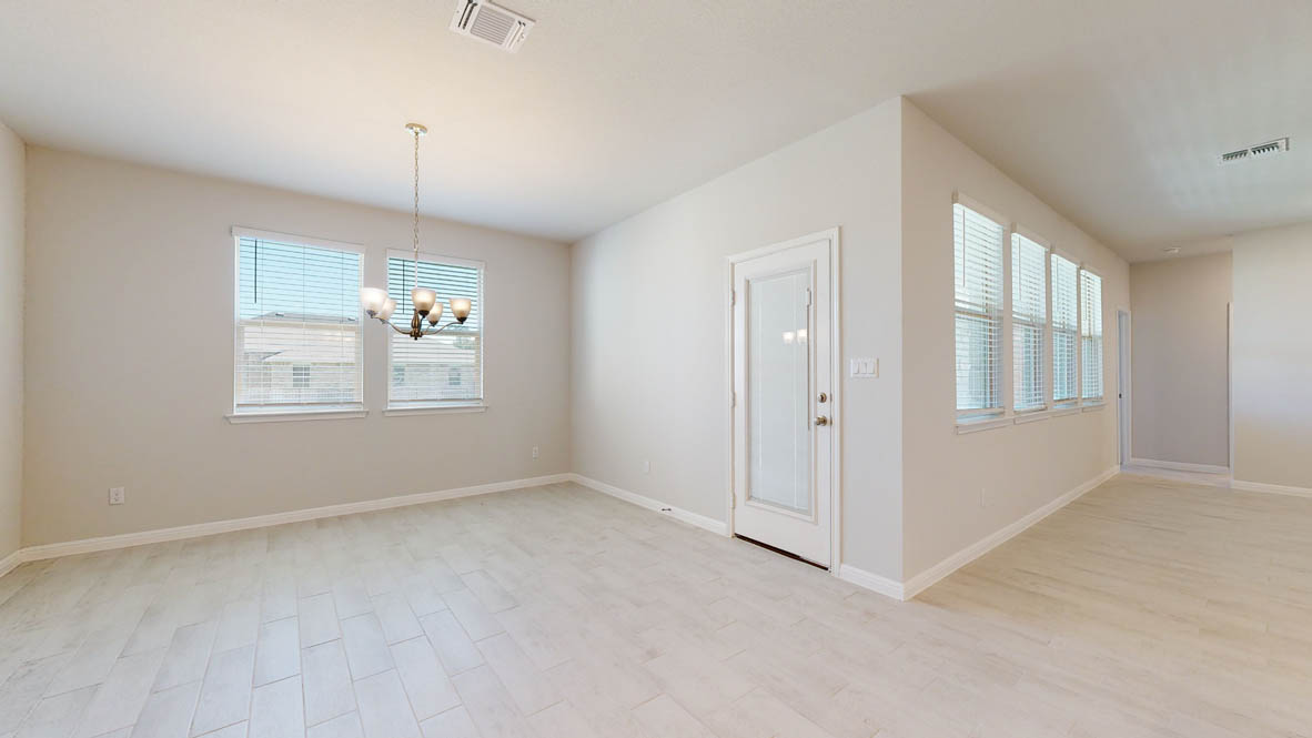 808 Gauge Road Thorndale, TX 76577 - Photo 9 of 31 A well-lit, open-concept area featuring light-colored flooring and ample natural illumination.
