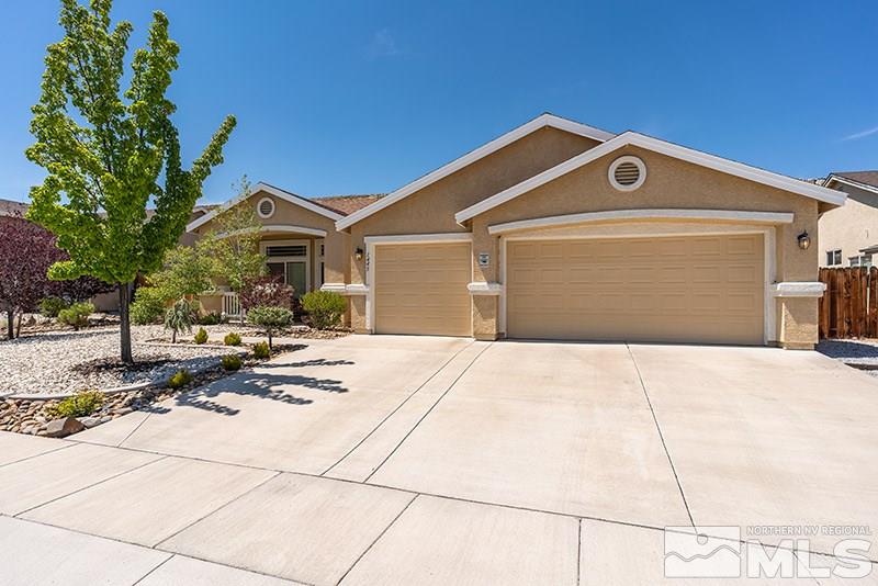 1445 Hagar Road Reno, NV 89506 - Photo 1 of 23 a front view of a house with yard