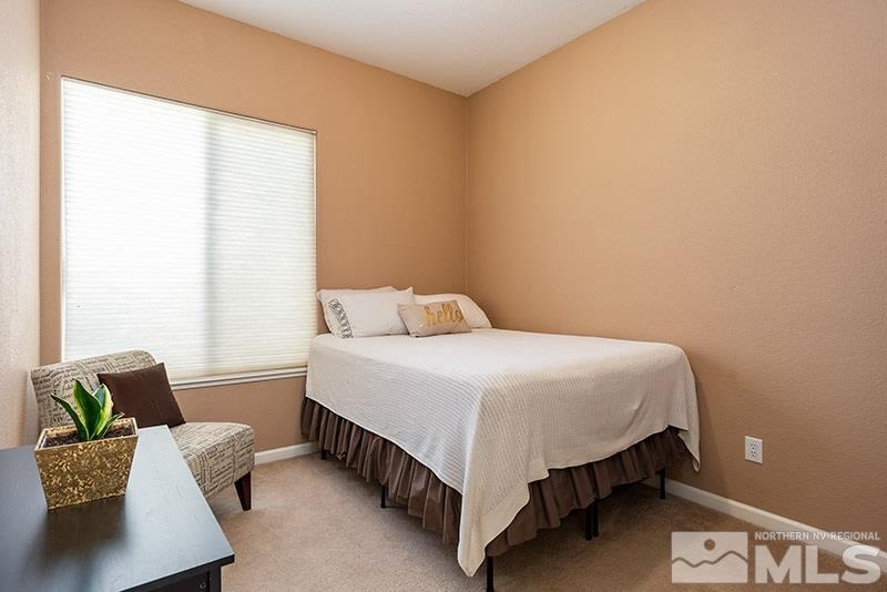 1445 Hagar Road Reno, NV 89506 - Photo 16 of 23 a bedroom with a bed and a couch