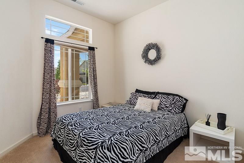 1445 Hagar Road Reno, NV 89506 - Photo 17 of 23 a bedroom with a bed and window