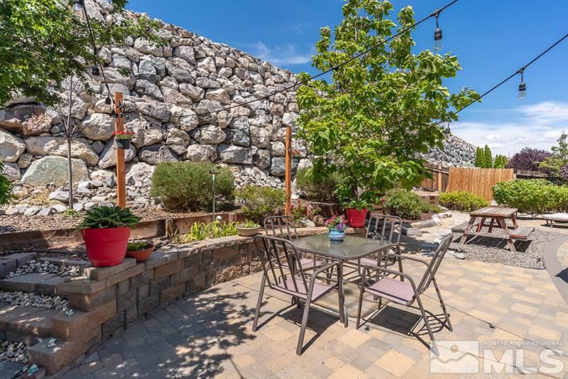 1445 Hagar Road Reno, NV 89506 - Photo 18 of 23 a view of a backyard with sitting area