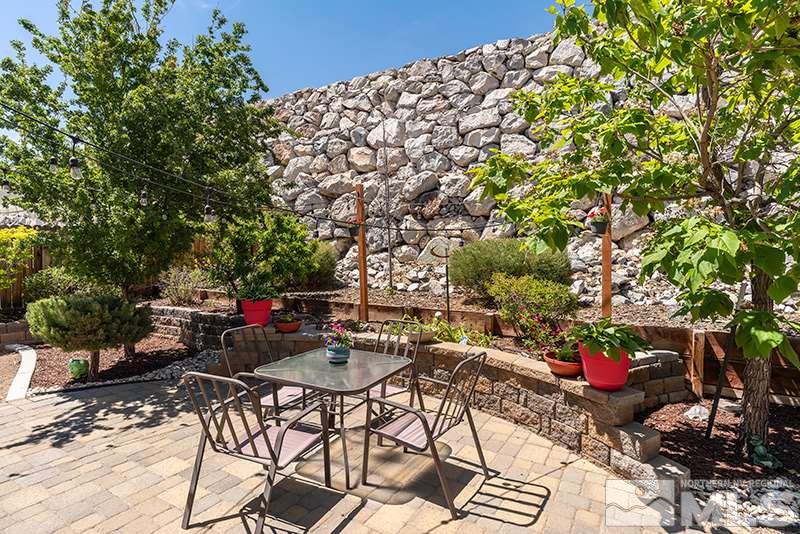 1445 Hagar Road Reno, NV 89506 - Photo 19 of 23 a view of a chairs and table in a backyard