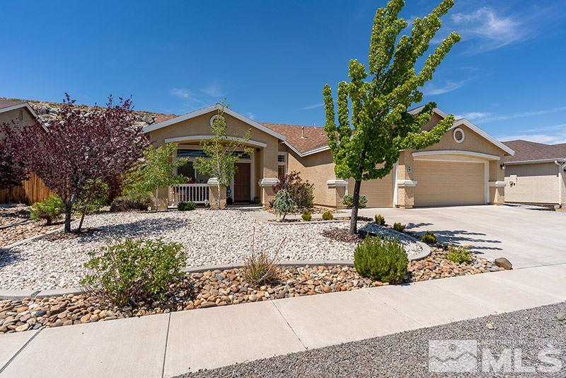 1445 Hagar Road Reno, NV 89506 - Photo 2 of 23 a front view of a house with a yard