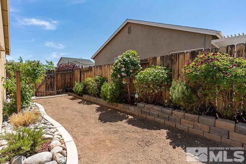 1445 Hagar Road Reno, NV 89506 - Photo 22 of 23 a front view of a house with garden