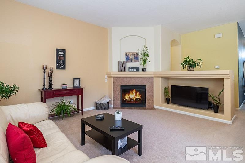 1445 Hagar Road Reno, NV 89506 - Photo 6 of 23 a living room with furniture and a fireplace