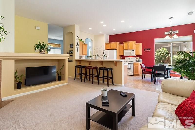 1445 Hagar Road Reno, NV 89506 - Photo 7 of 23 a living room with furniture and a fireplace