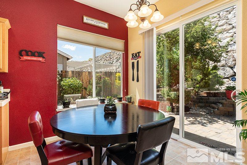 1445 Hagar Road Reno, NV 89506 - Photo 10 of 23 a view of a dining room with furniture window and outside view