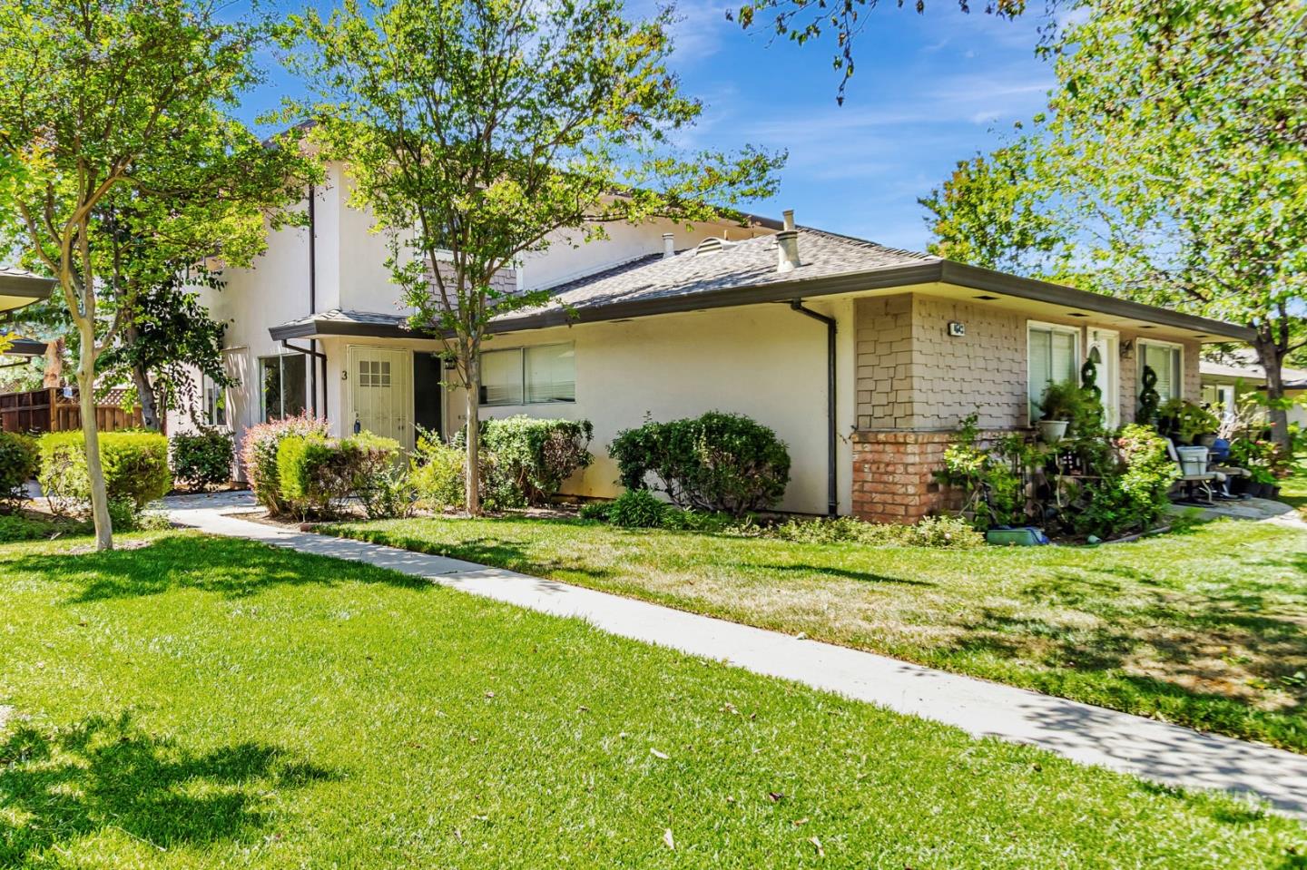 4643 Capay Drive, Unit 3 San Jose, CA 95118 - Photo 1 of 28 a front view of a house with a yard