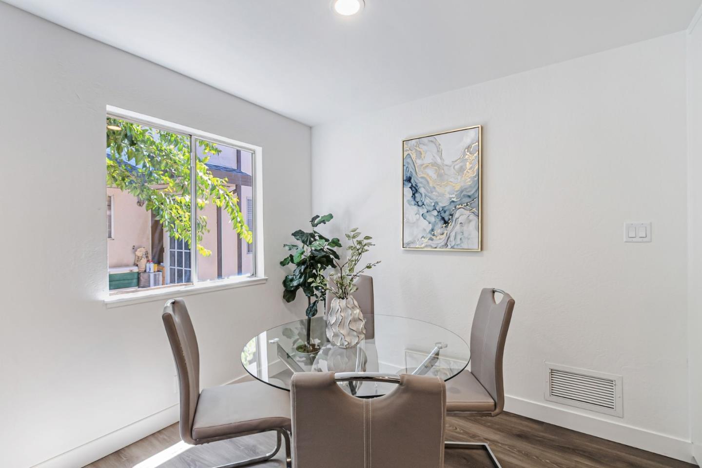 4643 Capay Drive, Unit 3 San Jose, CA 95118 - Photo 11 of 28 a view of a dining room with furniture window and wooden floor