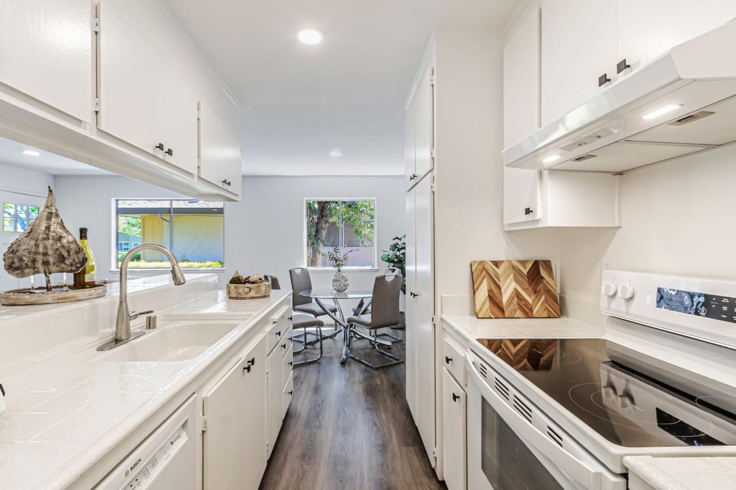 4643 Capay Drive, Unit 3 San Jose, CA 95118 - Photo 12 of 28 a kitchen with a sink a counter top space stainless steel appliances and cabinets