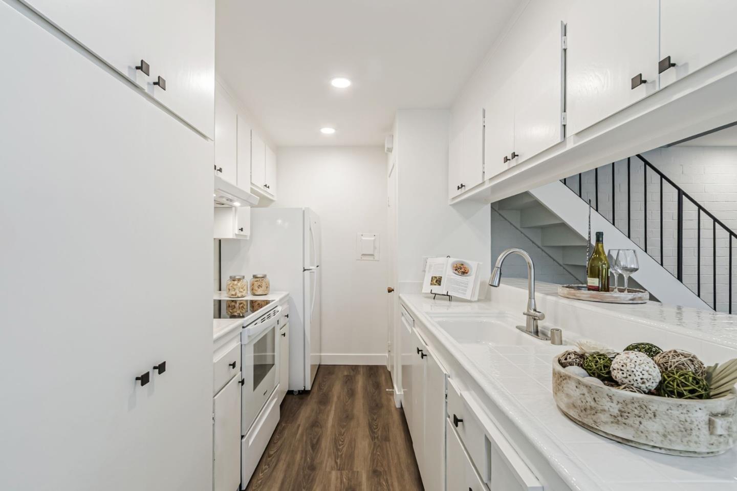 4643 Capay Drive, Unit 3 San Jose, CA 95118 - Photo 14 of 28 a kitchen with kitchen island granite countertop lots of counter top space