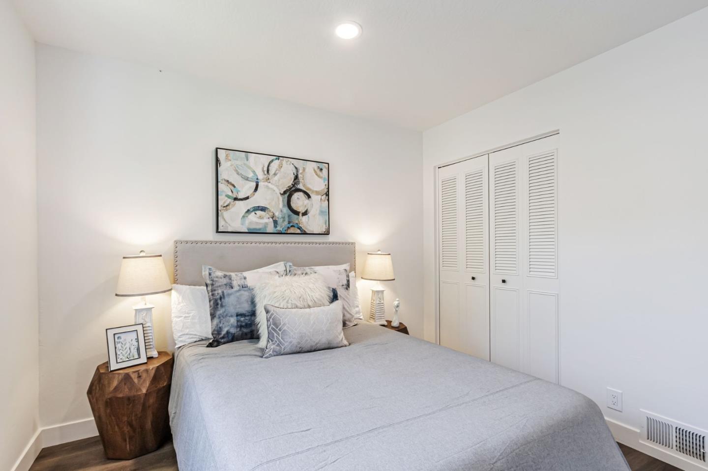 4643 Capay Drive, Unit 3 San Jose, CA 95118 - Photo 20 of 28 a bedroom with a bed and a painting on the wall