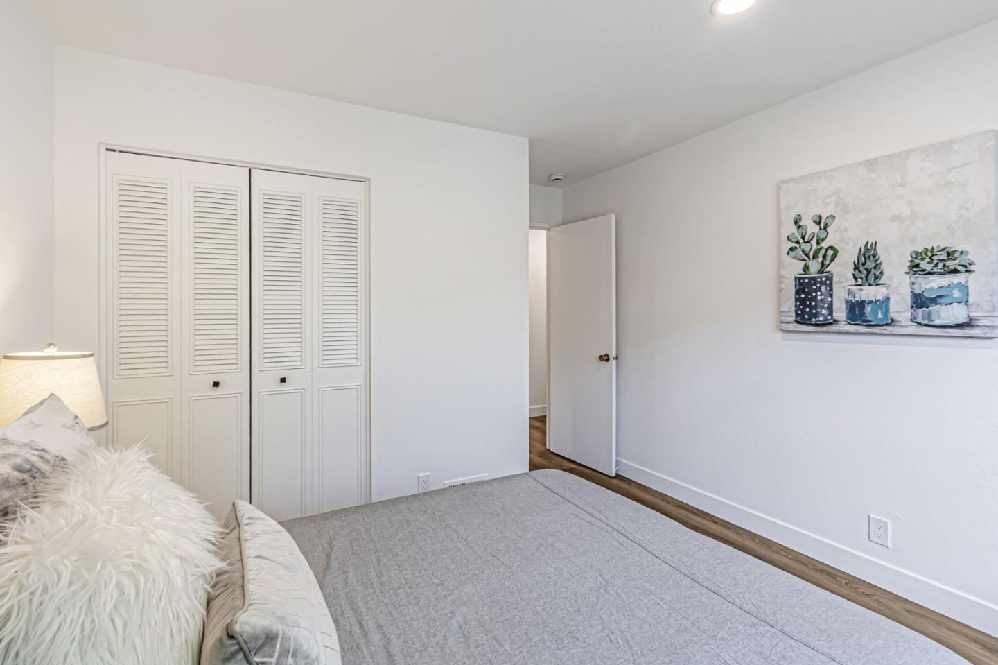 4643 Capay Drive, Unit 3 San Jose, CA 95118 - Photo 22 of 28 a view of a bedroom with a bed and hallway