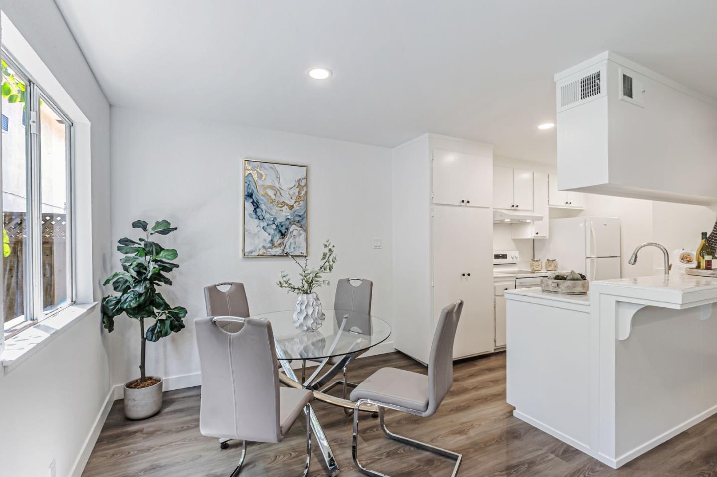 4643 Capay Drive, Unit 3 San Jose, CA 95118 - Photo 7 of 28 a kitchen with granite countertop a sink and chairs
