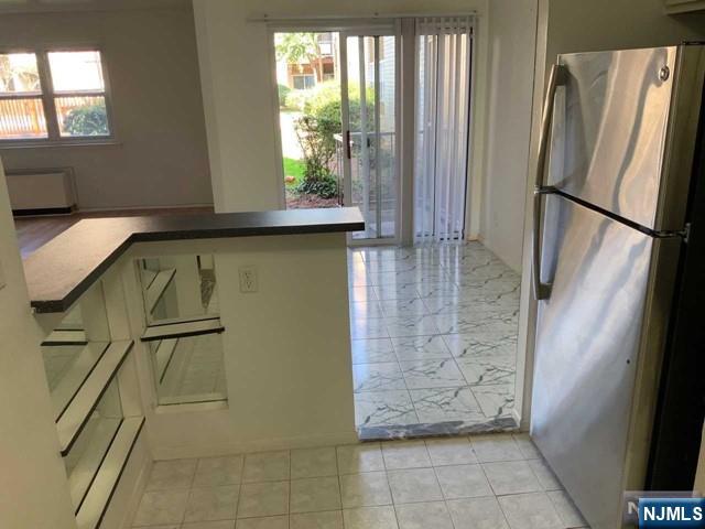 1111 River Road, Unit F2 Edgewater, NJ 07020 - Photo 9 of 21 a bathroom with a granite countertop shower and a sink