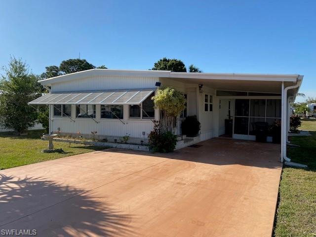106 Audubon Road Naples, FL 34114 - Photo 1 of 27 a view of a house with a yard and potted plants