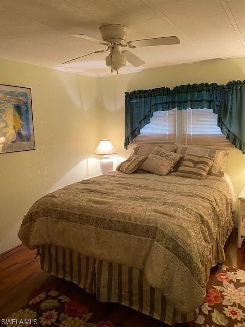 106 Audubon Road Naples, FL 34114 - Photo 18 of 27 a bedroom with a bed and a ceiling fan