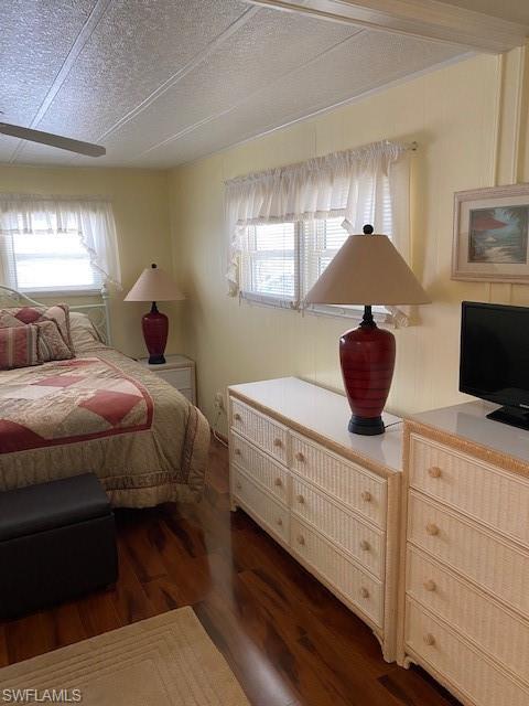 106 Audubon Road Naples, FL 34114 - Photo 23 of 27 a bedroom with a bed and a potted plant
