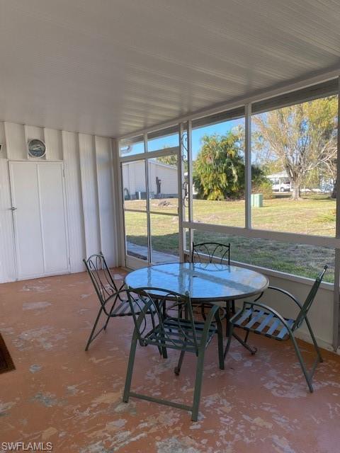 106 Audubon Road Naples, FL 34114 - Photo 26 of 27 a view of a dining room with furniture window and outside view