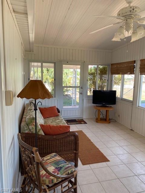 106 Audubon Road Naples, FL 34114 - Photo 4 of 27 a room with furniture and window