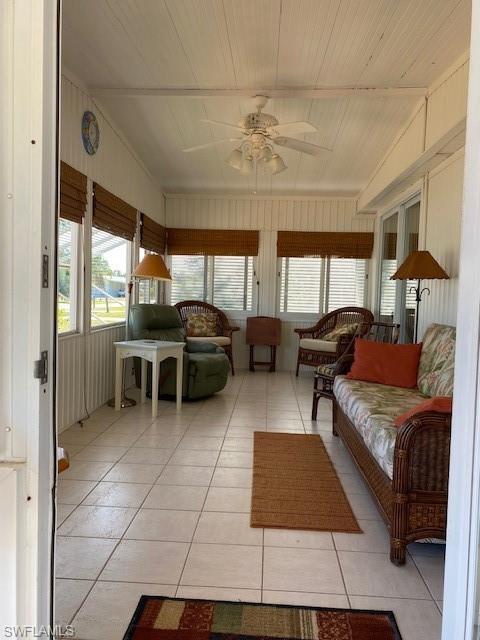 106 Audubon Road Naples, FL 34114 - Photo 5 of 27 a living room with furniture and a chandelier