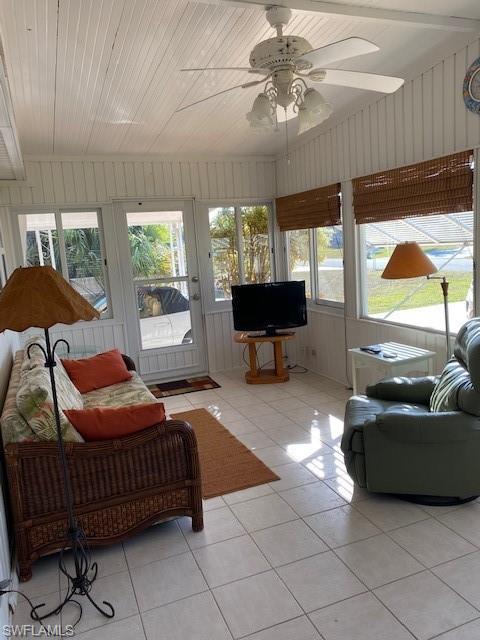 106 Audubon Road Naples, FL 34114 - Photo 6 of 27 a bedroom with furniture and a large window