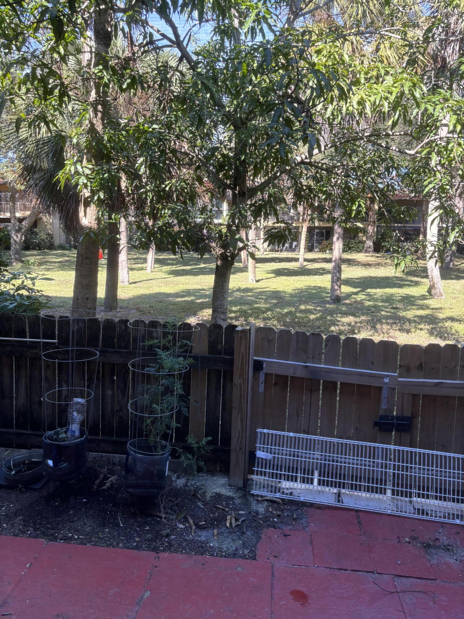 896 Southwest 9th St Circle, Unit 9 Boca Raton, FL 33486 - Photo 15 of 15 Boca Terrace 896 9 back yard 2025