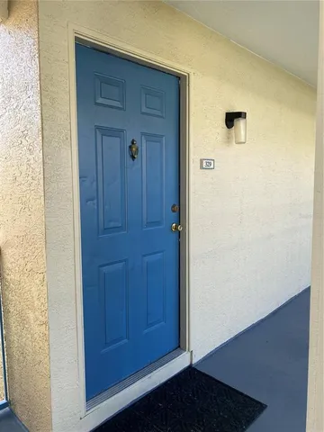 a view of a hallway with seating area