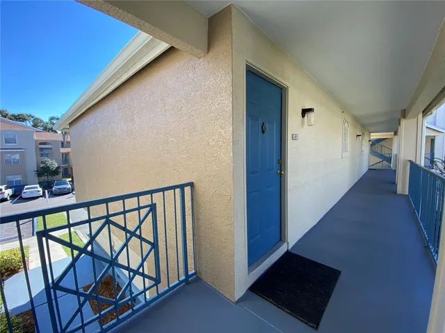 a view of a building with a yard