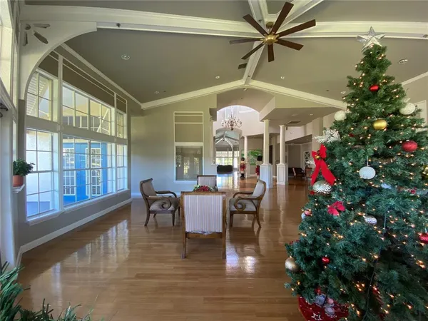 a living room filled with furniture and flowers