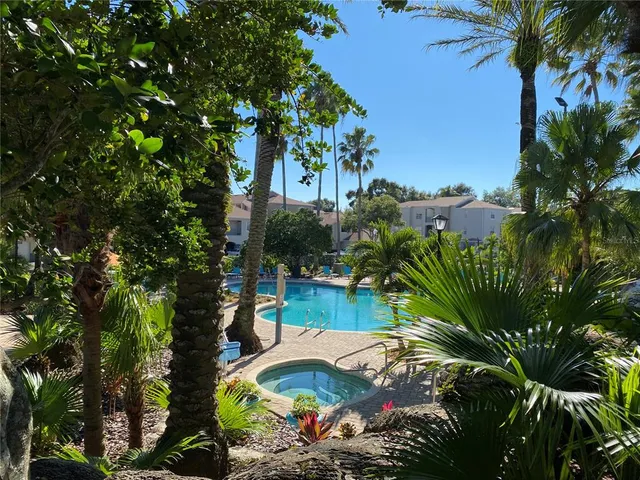 a patio with tables and chairs