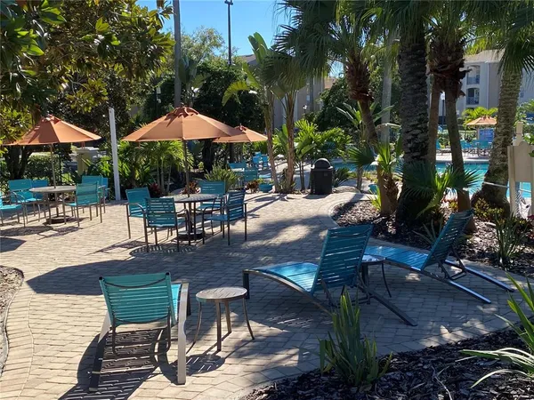 an aerial view of a house with a yard and outdoor seating