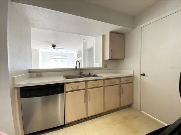 a kitchen with sink and window
